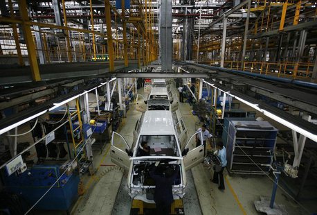 Employees work on the Chevrolet Tavera compact MPV assembly line inside a plant of General Motors India Ltd. at Halol, east of the western I Employees work on the Chevrolet Tavera compact MPV assembly line inside a plant of General Motors India Ltd. at Halol, east of the western I
