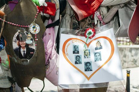Tributes hang from an olive tree that was planted on D'amelio street in memory of the bomb attack that killed Italian judge Paolo Borsellino Tributes hang from an olive tree that was planted on D'amelio street in memory of the bomb attack that killed Italian judge Paolo Borsellino