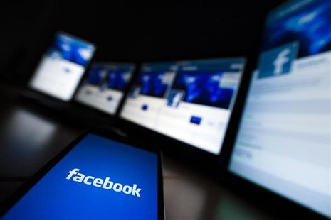 The loading screen of the Facebook application on a mobile phone is seen in this photo illustration taken in Lavigny May 16, 2012. REUTERS/V The loading screen of the Facebook application on a mobile phone is seen in this photo illustration taken in Lavigny May 16, 2012. REUTERS/V