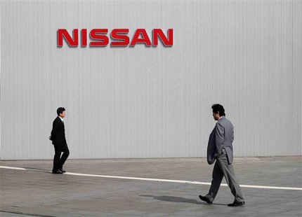 Men walk past a Nissan Motor Co logo at the company's global headquarters in Yokohama, south of Tokyo in this February 9, 2011 file photo. R Men walk past a Nissan Motor Co logo at the company's global headquarters in Yokohama, south of Tokyo in this February 9, 2011 file photo. R