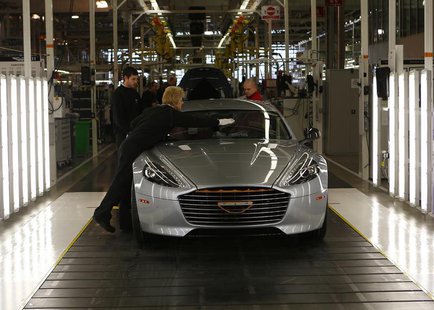 Workers inspect an Aston Martin Rapide S at their production facility in Gaydon, central England February 28, 2013. REUTERS/Darren Staples Workers inspect an Aston Martin Rapide S at their production facility in Gaydon, central England February 28, 2013. REUTERS/Darren Staples