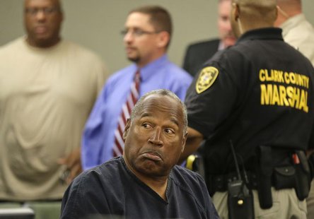 O.J. Simpson reacts after speaking to his attorneys in Clark County District Court during a break in his evidentiary hearing in Las Vegas, N O.J. Simpson reacts after speaking to his attorneys in Clark County District Court during a break in his evidentiary hearing in Las Vegas, N
