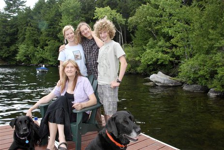 Writer Jennifer Finney Boylan, author of the book "Stuck in the Middle with You," sits with her spouse Deidre and their sons Zach and Sean ( Writer Jennifer Finney Boylan, author of the book "Stuck in the Middle with You," sits with her spouse Deidre and their sons Zach and Sean (
