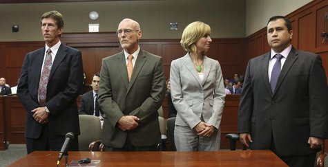 George Zimmerman listens as the verdict is announced that the jury finds him not guilty, with his attorneys Mark O'Mara (L) and co-counsel, George Zimmerman listens as the verdict is announced that the jury finds him not guilty, with his attorneys Mark O'Mara (L) and co-counsel,
