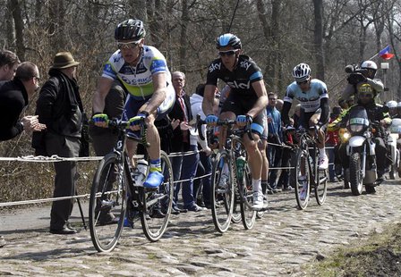 (L to R) Stuart O'Grady of Australia leads the breakaway followed by Mathew Hayman of Australia and Gert Steegmans of Belgium as they cycle (L to R) Stuart O'Grady of Australia leads the breakaway followed by Mathew Hayman of Australia and Gert Steegmans of Belgium as they cycle