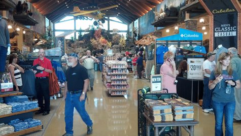 Customers walk around inside the new Cabela's store in Ashwaubenon on July 25, 2013. (Photo by: Jeff Flynt). Customers walk around inside the new Cabela's store in Ashwaubenon on July 25, 2013. (Photo by: Jeff Flynt).