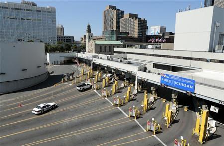Police vehicles are pictured at empty customs lanes entering the U.S. at the Detroit-Windsor Tunnel in Detroit, Michigan on July 12, 2012.
Credit: Reuters/Jeff Kowalsky Police vehicles are pictured at empty customs lanes entering the U.S. at the Detroit-Windsor Tunnel in Detroit, Michigan on July 12, 2012.
Credit: Reuters/Jeff Kowalsky