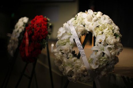 Wreaths are seen at a prayer vigil for the victims of the Asiana Airlines crash at West Valley Christian School in West Hills, Los Angeles, Wreaths are seen at a prayer vigil for the victims of the Asiana Airlines crash at West Valley Christian School in West Hills, Los Angeles,