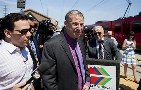 San Diego mayor Bob Filner (C), is surrounded by reporters as he attends a ground breaking ceremony for improvements for the San Diego Troll San Diego mayor Bob Filner (C), is surrounded by reporters as he attends a ground breaking ceremony for improvements for the San Diego Troll