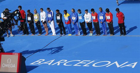 Competitors take part in a minute's silence for the victims of the train crash near Santiago de Compostela, before the women's 10m platform Competitors take part in a minute's silence for the victims of the train crash near Santiago de Compostela, before the women's 10m platform
