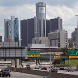 Vehicles enter and exit the downtown on the freeway, in front of General Motors World Headquarters in downtown Detroit, Michigan July 20, 20 Vehicles enter and exit the downtown on the freeway, in front of General Motors World Headquarters in downtown Detroit, Michigan July 20, 20