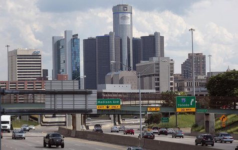 Vehicles enter and exit the downtown on the freeway, in front of General Motors World Headquarters in downtown Detroit, Michigan July 20, 20 Vehicles enter and exit the downtown on the freeway, in front of General Motors World Headquarters in downtown Detroit, Michigan July 20, 20