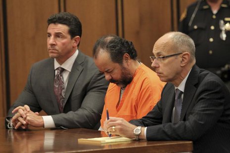 Ariel Castro, 52, sits with his head down between his attorneys Jaye Schlachet (R) and Craig Weintraub (L) during his pre-trial hearing on c Ariel Castro, 52, sits with his head down between his attorneys Jaye Schlachet (R) and Craig Weintraub (L) during his pre-trial hearing on c