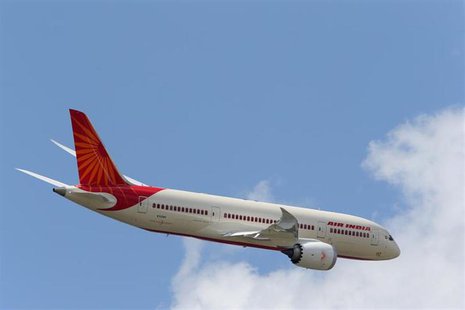 An Air India Airlines Boeing 787 dreamliner takes part in a flying display during the 50th Paris Air Show at the Le Bourget airport near Par An Air India Airlines Boeing 787 dreamliner takes part in a flying display during the 50th Paris Air Show at the Le Bourget airport near Par