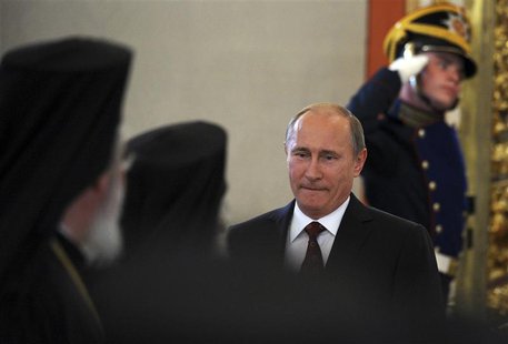Russian President Vladimir Putin arrives for a meeting with Russian Orthodox church officials in Moscow's Kremlin July 25, 2013. REUTERS/Ale Russian President Vladimir Putin arrives for a meeting with Russian Orthodox church officials in Moscow's Kremlin July 25, 2013. REUTERS/Ale