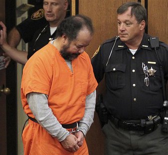 Ariel Castro, 53, walks into the court room with his head down for a pre-trial hearing on charges including rape, kidnapping and murder in C Ariel Castro, 53, walks into the court room with his head down for a pre-trial hearing on charges including rape, kidnapping and murder in C