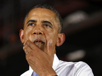 U.S. President Barack Obama gestures while he speaks about the U.S. economy inside the main warehouse at the Jacksonville Port in Florida, J U.S. President Barack Obama gestures while he speaks about the U.S. economy inside the main warehouse at the Jacksonville Port in Florida, J