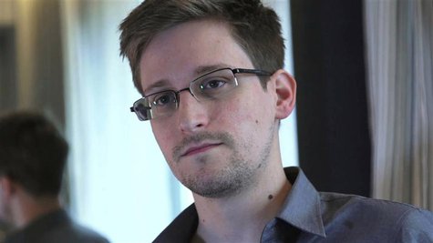Former U.S. spy agency contractor Edward Snowden is seen in this still image taken from video during an interview by The Guardian in his hot Former U.S. spy agency contractor Edward Snowden is seen in this still image taken from video during an interview by The Guardian in his hot