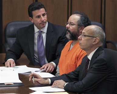 Ariel Castro (C), 53, listens to the judge as he sits between his attorneys Jaye Schlachet (R) and Craig Weintraub in the courtroom in Cleve Ariel Castro (C), 53, listens to the judge as he sits between his attorneys Jaye Schlachet (R) and Craig Weintraub in the courtroom in Cleve