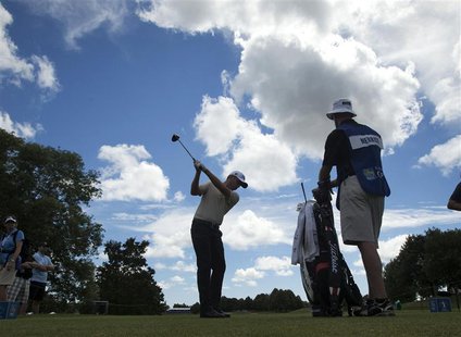 John Merrick of the U.S. tees off on the seventeenth hole of the Canadian Open golf tournament at the Glen Abbey Golf Club in Oakville, July John Merrick of the U.S. tees off on the seventeenth hole of the Canadian Open golf tournament at the Glen Abbey Golf Club in Oakville, July