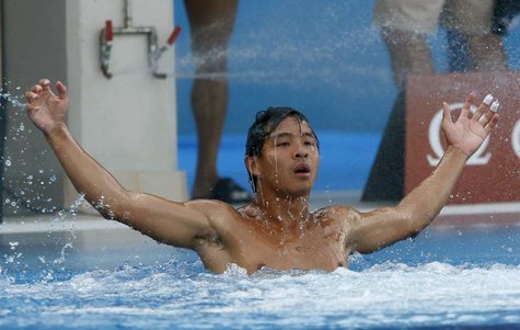 China's He Chong celebrates his victory after his last dive at the men's 3m springboard final during the World Swimming Championships at the China's He Chong celebrates his victory after his last dive at the men's 3m springboard final during the World Swimming Championships at the