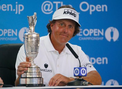 Phil Mickelson of the U.S. sits with the Claret Jug at a press conference after winning the British Open golf championship at Muirfield in S Phil Mickelson of the U.S. sits with the Claret Jug at a press conference after winning the British Open golf championship at Muirfield in S