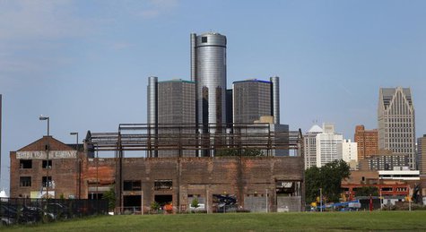 General Motors World Headquarters is seen behind a historic warehouse being restored along the Detroit River in Detroit, Michigan July 21, 2 General Motors World Headquarters is seen behind a historic warehouse being restored along the Detroit River in Detroit, Michigan July 21, 2