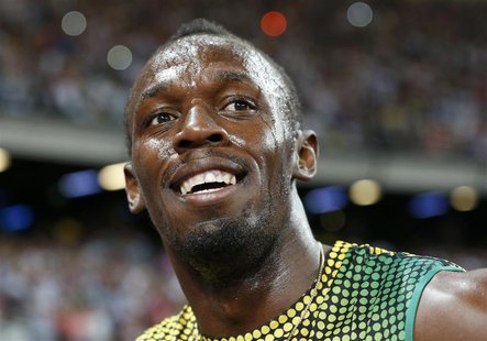 Usain Bolt of Jamaica smiles after winning the men's 100m event at the London Diamond League 'Anniversary Games' athletics meeting at the Ol Usain Bolt of Jamaica smiles after winning the men's 100m event at the London Diamond League 'Anniversary Games' athletics meeting at the Ol