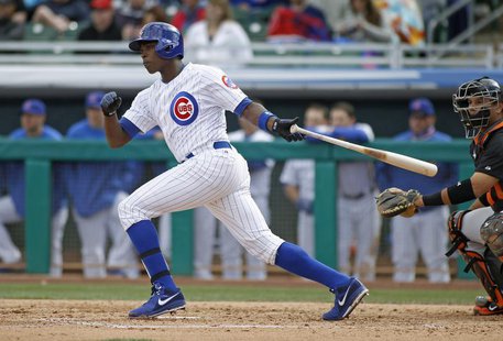 Chicago Cubs' Alfonso Soriano lines a single to the outfield against the San Francisco Giants during their MLB Cactus League spring training Chicago Cubs' Alfonso Soriano lines a single to the outfield against the San Francisco Giants during their MLB Cactus League spring training