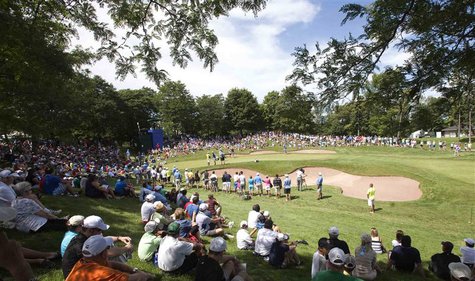 Golf patrons watch action on the ninth green during the second round at the Canadian Open golf tournament at the Glen Abbey Golf Club in Oak Golf patrons watch action on the ninth green during the second round at the Canadian Open golf tournament at the Glen Abbey Golf Club in Oak
