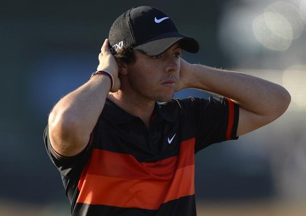 Rory McIlroy of Northern Ireland walks off the 18th green after playing his second round of the British Open golf Championship at Muirfield Rory McIlroy of Northern Ireland walks off the 18th green after playing his second round of the British Open golf Championship at Muirfield