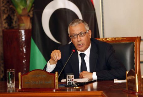Libya's Prime Minister Ali Zeidan (C) speaks during a joint news conference at the headquarters of the Prime Minister's Office in Tripoli Ma Libya's Prime Minister Ali Zeidan (C) speaks during a joint news conference at the headquarters of the Prime Minister's Office in Tripoli Ma