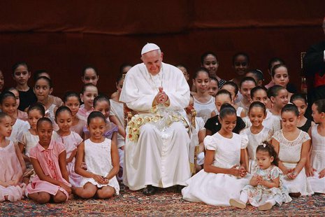 Pope Francis meets with children during an encounter with representatives of the civil society in the Municipal Theater in Rio de Janeiro, J Pope Francis meets with children during an encounter with representatives of the civil society in the Municipal Theater in Rio de Janeiro, J
