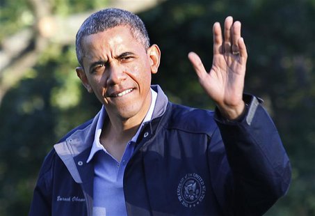 U.S. President Barack Obama waves as he walks on the South Lawn of the White House upon his return to Washington from Camp David, July 26, 2 U.S. President Barack Obama waves as he walks on the South Lawn of the White House upon his return to Washington from Camp David, July 26, 2