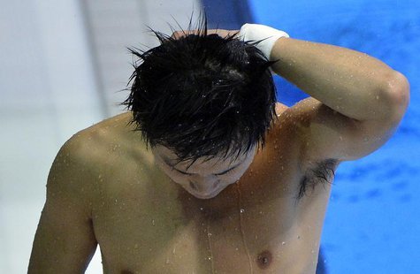 China's Qui Bo reacts after his last dive during the men's 10m platform final at the London 2012 Olympic Games at the Aquatics Centre August China's Qui Bo reacts after his last dive during the men's 10m platform final at the London 2012 Olympic Games at the Aquatics Centre August
