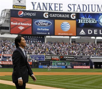 New York Yankees Hideki Matsui walks onto the field before their MLB American League game with the Tampa Bay Rays at Yankee Stadium in New Y New York Yankees Hideki Matsui walks onto the field before their MLB American League game with the Tampa Bay Rays at Yankee Stadium in New Y