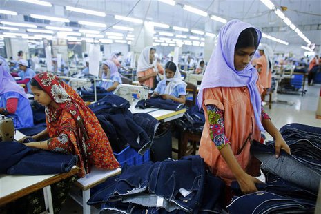Workers sort clothes at a garment factory near the collapsed Rana Plaza building in Savar, Bangladesh June 16, 2013. REUTERS/Andrew Biraj Workers sort clothes at a garment factory near the collapsed Rana Plaza building in Savar, Bangladesh June 16, 2013. REUTERS/Andrew Biraj