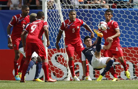 Joe Corona (2nd R) of the U.S. is surrounded by Panama players during the first half of the CONCACAF Gold Cup soccer final in Chicago, Illin Joe Corona (2nd R) of the U.S. is surrounded by Panama players during the first half of the CONCACAF Gold Cup soccer final in Chicago, Illin