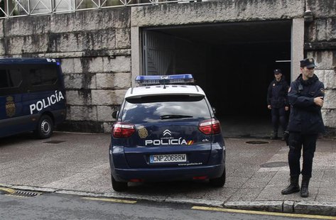A police car arrives at the courthouse with Francisco Garzon inside in Santiago de Compostela, northwestern Spain, July 28, 2013. REUTERS/Mi A police car arrives at the courthouse with Francisco Garzon inside in Santiago de Compostela, northwestern Spain, July 28, 2013. REUTERS/Mi