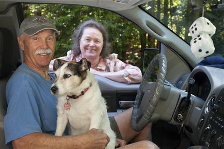 Kent Holder, a volunteer with Fox Island Citizens' Patrol, poses for a portrait with his wife, Ann, who is also a volunteer, and dog, Badger, for Reuters on Fox Island, Washington July 27, 2013. Credit: Reuters/David Ryder Kent Holder, a volunteer with Fox Island Citizens' Patrol, poses for a portrait with his wife, Ann, who is also a volunteer, and dog, Badger, for Reuters on Fox Island, Washington July 27, 2013. Credit: Reuters/David Ryder