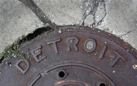'Detroit' is seen on the top of an iron man-hole cover on a street in Detroit, Michigan July 27, 2013. REUTERS/ Rebecca Cook 'Detroit' is seen on the top of an iron man-hole cover on a street in Detroit, Michigan July 27, 2013. REUTERS/ Rebecca Cook