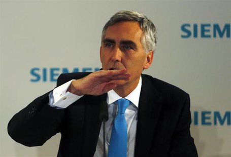 Peter Loescher, chief executive of German engineering conglomerate Siemens AG addresses the media ahead of the company's annual shareholder Peter Loescher, chief executive of German engineering conglomerate Siemens AG addresses the media ahead of the company's annual shareholder