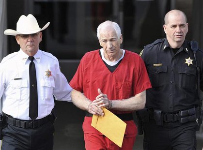Jerry Sandusky (C) leaves the Centre County Courthouse after his sentencing in his child sex abuse case in Bellefonte, Pennsylvania October Jerry Sandusky (C) leaves the Centre County Courthouse after his sentencing in his child sex abuse case in Bellefonte, Pennsylvania October