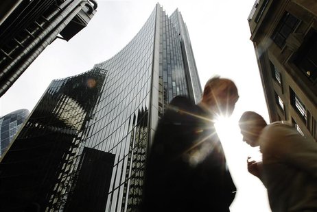 Pedestrians pass office blocks in the City of London June 19, 2013. REUTERS/Luke MacGregor Pedestrians pass office blocks in the City of London June 19, 2013. REUTERS/Luke MacGregor