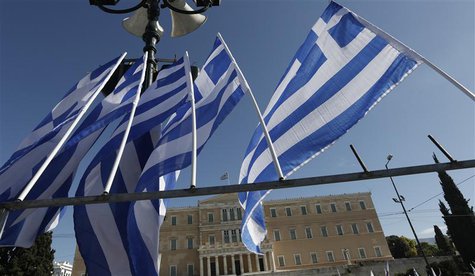 Greek flags fly in front of the parliament building during a rally in central Athens November 6, 2012. REUTERS/Yorgos Karahalis Greek flags fly in front of the parliament building during a rally in central Athens November 6, 2012. REUTERS/Yorgos Karahalis