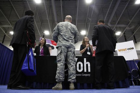 Jobseekers talk to recruiters from Yoh, a staffing agency, during a Hire Our Heroes job fair targeting unemployed military veterans and spon Jobseekers talk to recruiters from Yoh, a staffing agency, during a Hire Our Heroes job fair targeting unemployed military veterans and spon
