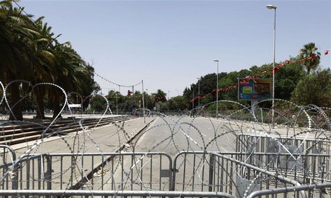The capital's central Bardo square, where Tunisia's Constituent Assembly is located, is seen sealed off by the army with barbed wire and fen The capital's central Bardo square, where Tunisia's Constituent Assembly is located, is seen sealed off by the army with barbed wire and fen