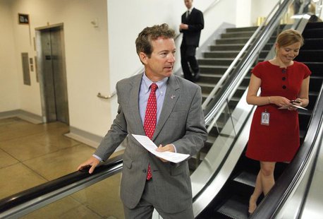 U.S. Senator Rand Paul (R-KY) (L) departs following the weekly Republican caucus luncheon at the U.S. Capitol in Washington June 18, 2013. R U.S. Senator Rand Paul (R-KY) (L) departs following the weekly Republican caucus luncheon at the U.S. Capitol in Washington June 18, 2013. R