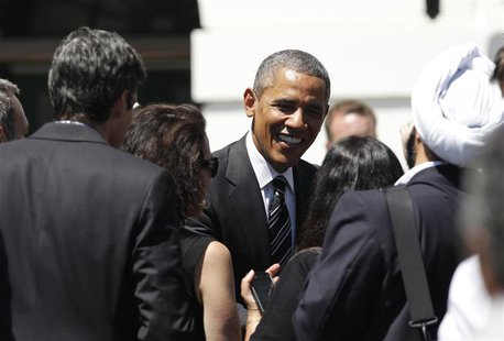 U.S. President Barack Obama greets members of the audience as he honors the San Francisco Giants, the 2012 World Series champions baseball t U.S. President Barack Obama greets members of the audience as he honors the San Francisco Giants, the 2012 World Series champions baseball t