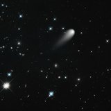 The sun-approaching Comet ISON floats against a seemingly infinite backdrop of numerous galaxies and a handful of foreground stars in this A The sun-approaching Comet ISON floats against a seemingly infinite backdrop of numerous galaxies and a handful of foreground stars in this A